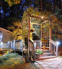 Well-lit path to house at night