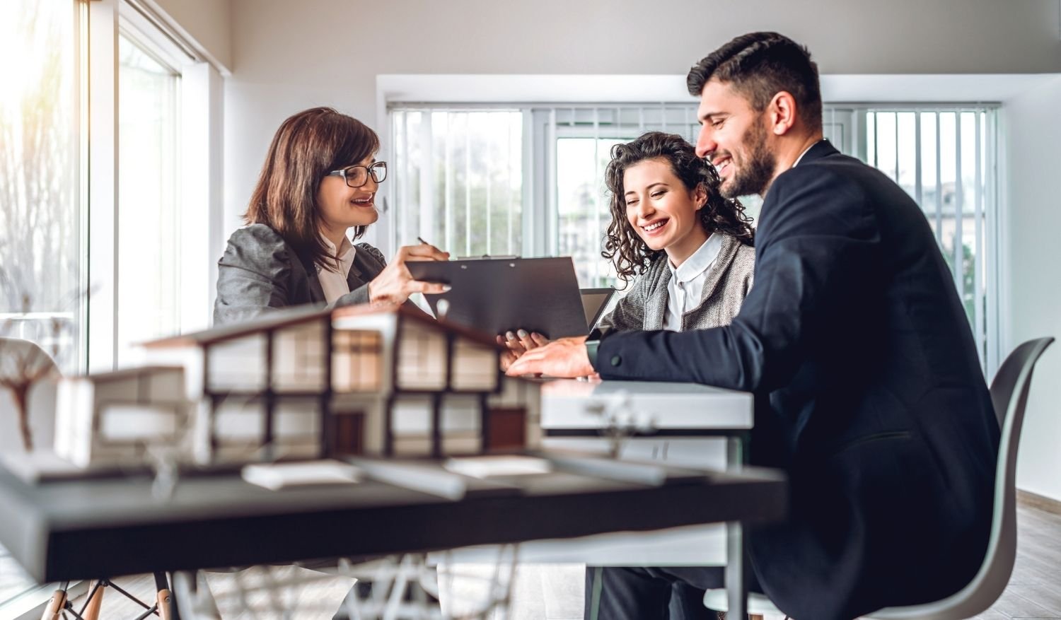 An agent sharing her real estate marketing materials with potential clients